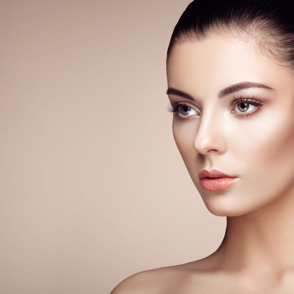 Beautiful woman face. Perfect makeup. Beauty fashion. Eyelashes. Cosmetic Eyeshadow. Highlighting